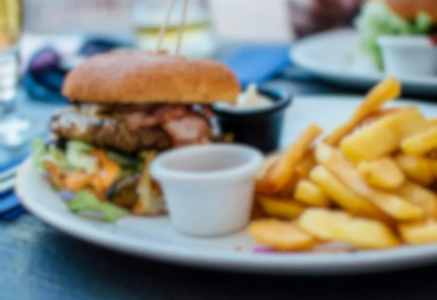 A steakburger and fries on a plate